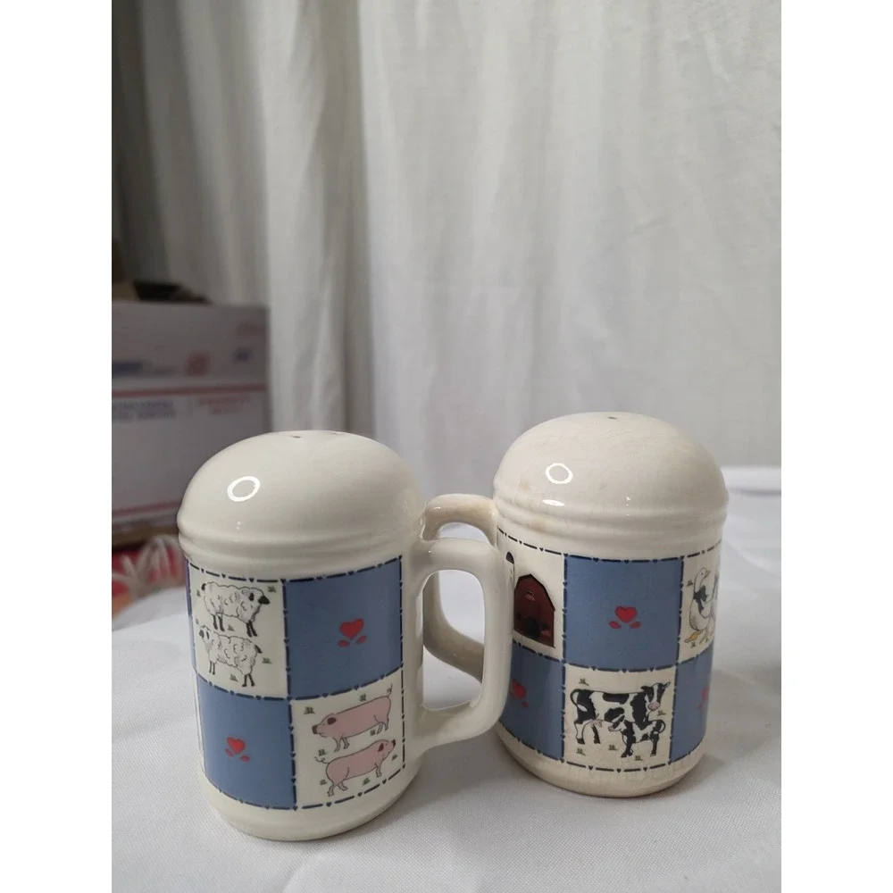 Checkerboard Farms ceramic salt and pepper shakers featuring a blue and white...